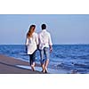 happy young romantic couple in love have fun on beautiful beach at beautiful summer day