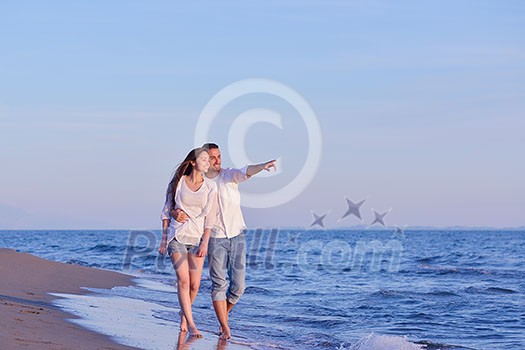 happy young romantic couple in love have fun on beautiful beach at beautiful summer day happy young romantic couple in love have fun on beautiful beach at beautiful summer day