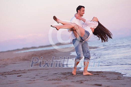 happy young romantic couple in love have fun on beautiful beach at beautiful summer day happy young romantic couple in love have fun on beautiful beach at beautiful summer day
