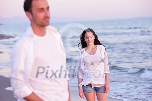 happy young romantic couple in love have fun on beautiful beach at beautiful summer day happy young romantic couple in love have fun on beautiful beach at beautiful summer day