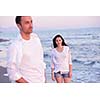 happy young romantic couple in love have fun on beautiful beach at beautiful summer day