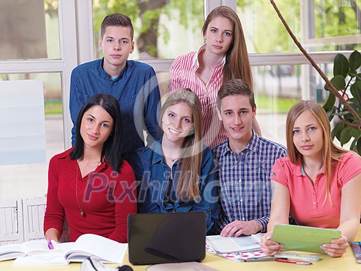 happy young teens group in school on chemisty lessons and library education happy young teens group in school on chemisty lessons and library education