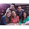 happy young teens group in school on chemisty lessons and library education