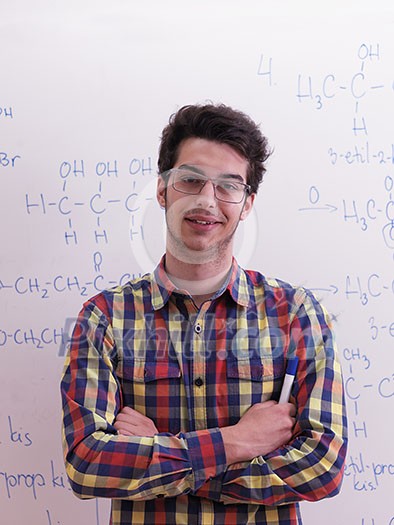 happy young teen boy in school on chemistry classes and library happy young teen boy in school on chemistry classes and library