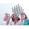 happy young teens group in school on chemisty lessons and library education