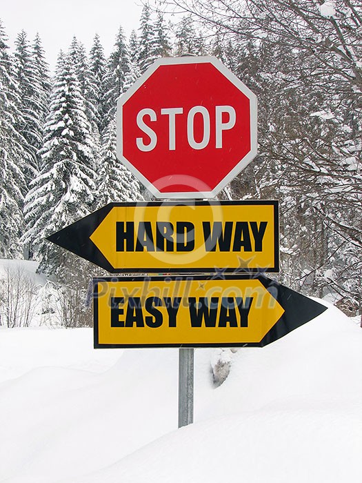 hard and easy way road sign in nature hard and easy way road sign in nature