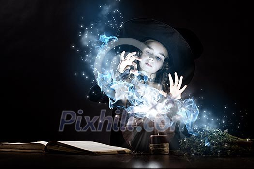 Little Halloween witch reading conjure above pot Little Halloween witch reading conjure above pot