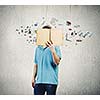 Young man in casual holding opened book with icons flying out