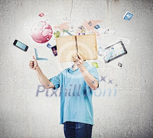 Young man in casual holding opened book with icons flying out Young man in casual holding opened book with icons flying out