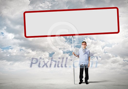 Young man on road holding blank banner. Place for text Young man on road holding blank banner. Place for text