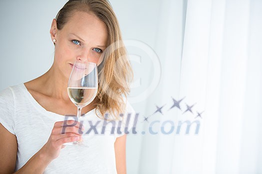 Gorgeous young woman with a glass of wine, smelling the lovely drink, savouring every sip (shallow DOF; color toned image) Gorgeous young woman with a glass of wine, smelling the lovely drink, savouring every sip (shallow DOF; color toned image)