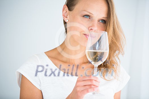 Gorgeous young woman with a glass of wine, smelling the lovely drink, savouring every sip (shallow DOF; color toned image) Gorgeous young woman with a glass of wine, smelling the lovely drink, savouring every sip (shallow DOF; color toned image)