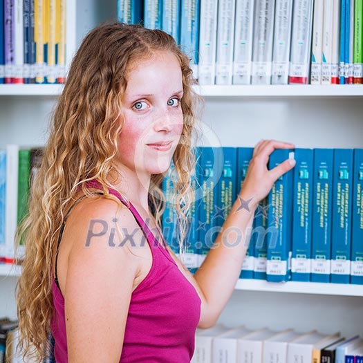 Pretty, young college student female college student in a library (shallow DOF; color toned image) Pretty, young college student female college student in a library (shallow DOF; color toned image)