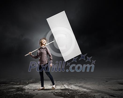 Young woman in casual carrying white blank banner Young woman in casual carrying white blank banner