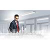 Businessman looking at digital construction project of modern city
