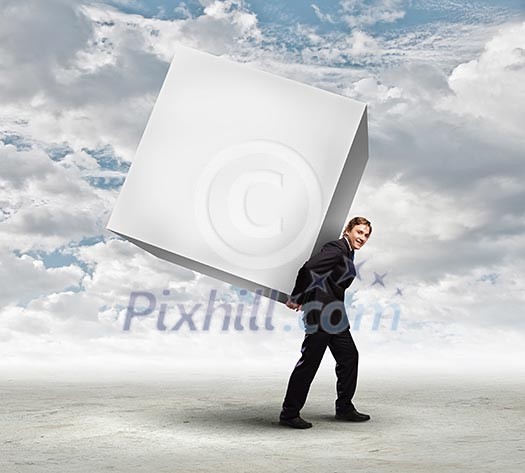 Young businessman carrying white blank cube. Place for text Young businessman carrying white blank cube. Place for text