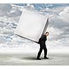 Young businessman carrying white blank cube. Place for text