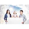 Young happy family with white blank banner. Place for text