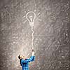 Young woman in casual holding bulb balloon. Idea concept