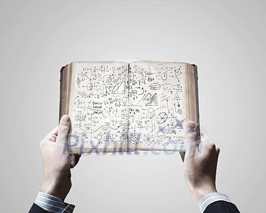 Close up of businessman hands holding opened notepad with sketches Close up of businessman hands holding opened notepad with sketches