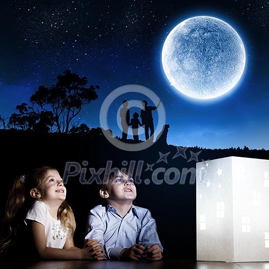 Cute little boy and girl looking at model of house Cute little boy and girl looking at model of house