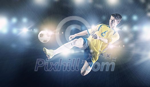 Young football player on stadium kicking ball Young football player on stadium kicking ball