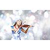 Young attractive woman in blue dress playing violin