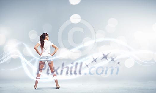 Rear view of young woman in shorts and white t-shirt Rear view of young woman in shorts and white t-shirt