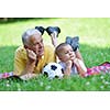 happy grandfather and child have fun and play in park