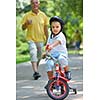 happy grandfather and child have fun and play in park