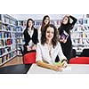 happy student woman group portrait at library 