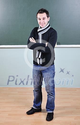 happy young student boy posing at university school classroom happy young student boy posing at university school classroom