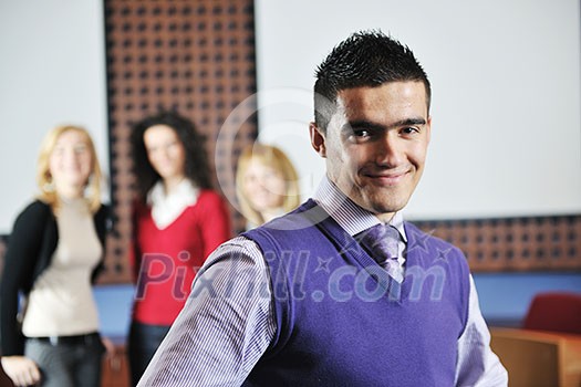 happy young student boy posing at university school classroom happy young student boy posing at university school classroom