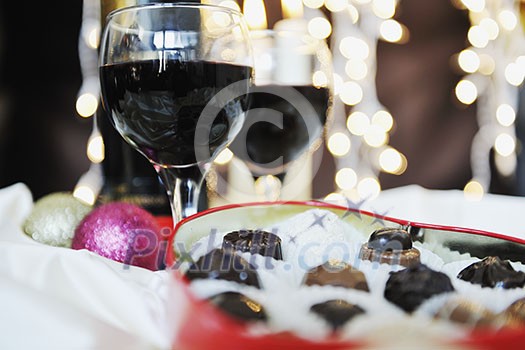 luxury and sweet praline and chocolate with wine bottle and glasses decoration luxury and sweet praline and chocolate with wine bottle and glasses decoration