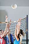 volleyball game sport with group of girls indoor in sport arena