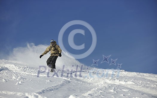 freestyle snowboarder jump and ride free style  at sunny winter day on mountain