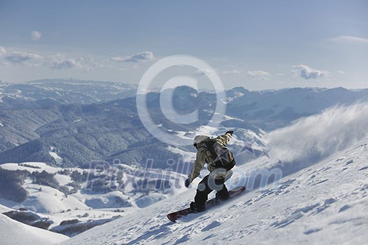 freestyle snowboarder jump and ride free style at sunny winter day on mountain freestyle snowboarder jump and ride free style at sunny winter day on mountain