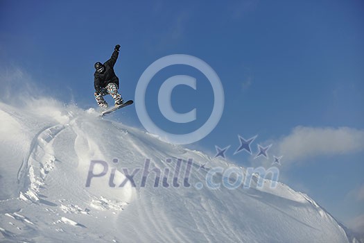 freestyle snowboarder jump and ride free style at sunny winter day on mountain freestyle snowboarder jump and ride free style at sunny winter day on mountain