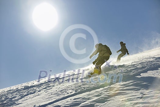 freestyle snowboarder jump and ride free style at sunny winter day on mountain freestyle snowboarder jump and ride free style at sunny winter day on mountain