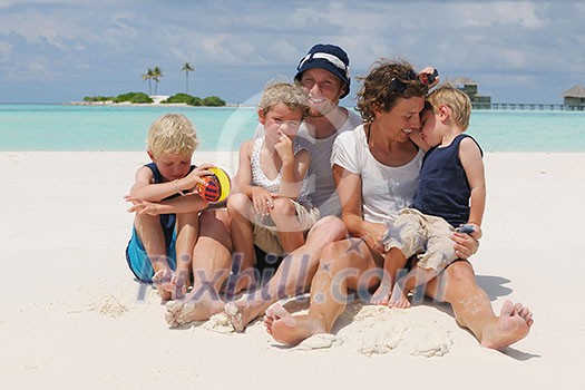 Portrait of a happy family on summer vacation at beach Portrait of a happy family on summer vacation at beach
