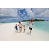 Portrait of a happy family on summer vacation  at beach