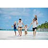 Portrait of a happy family on summer vacation  at beach