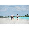 Portrait of a happy family on summer vacation  at beach