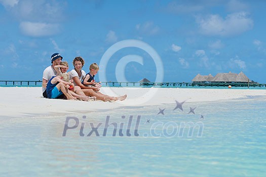 Portrait of a happy family on summer vacation at beach Portrait of a happy family on summer vacation at beach