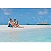 Portrait of a happy family on summer vacation  at beach