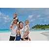 Portrait of a happy family on summer vacation  at beach