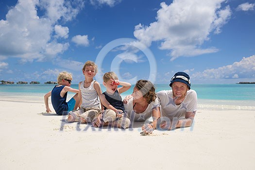 Portrait of a happy family on summer vacation at beach Portrait of a happy family on summer vacation at beach