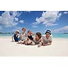 Portrait of a happy family on summer vacation  at beach
