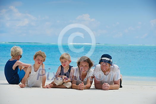 Portrait of a happy family on summer vacation at beach Portrait of a happy family on summer vacation at beach