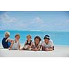 Portrait of a happy family on summer vacation  at beach